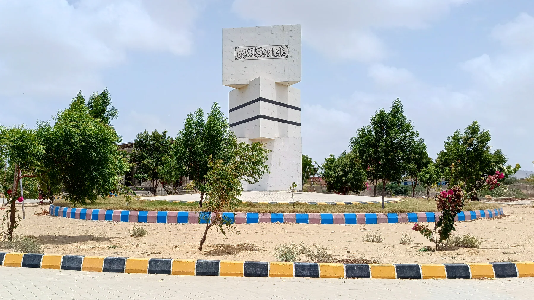 The Jannat City monument surrounded by trees and landscaped grounds